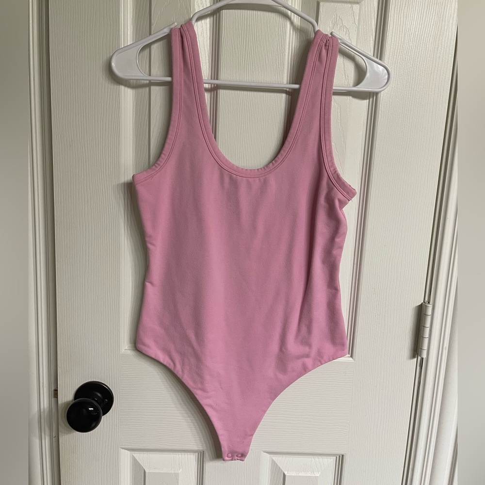Nuuds Pink Seamless Scoop Tank Bodysuit.